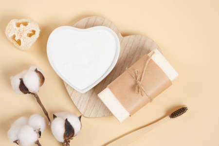 eco friendly body care set, soap, soda, loofah and cotton flower on beige background, bamboo toothbrush. zero waste lifestyle concept, natural cosmetics top view copy spaceの写真素材