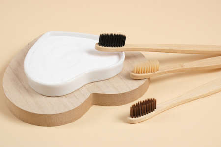 eco-friendly bamboo teethbrush. bamboo toothbrushes and baking soda on beige background zero waste...