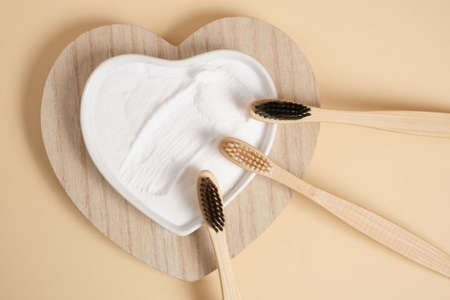 eco-friendly bamboo teethbrush. bamboo toothbrushes and baking soda on beige background zero waste life style concept. brushing your teeth with sodaの写真素材