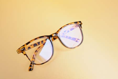 fashion trendy eyes glasses for correcting vision on a creative background, wave from paper,...