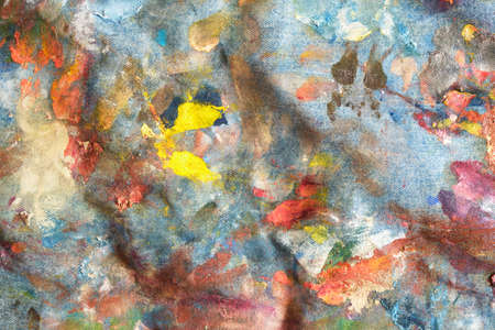 denim fabric with dried oil paint strokes, texture, artist apron