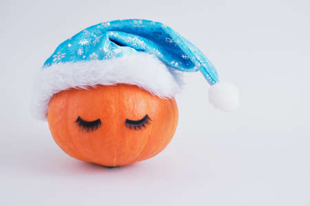 pumkin in santa hat on gray background copy spaceの写真素材