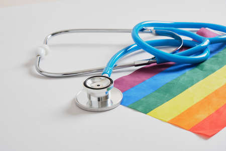 medical stethoscope and lgbtq community flag on gray background copy space, individual approach in medicine conceptの写真素材