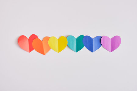 rainbow colored paper hearts on gray background, pride concept top view copy space mock upの写真素材