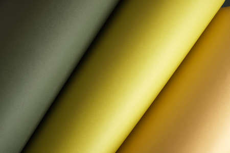 Green-colored sheets among minimalism, pastel colors, abstraction paper background, rolled sheets of paper copy space mock upの写真素材