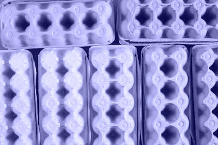 several cardboard egg boxes, recycling concept waste, sorting waste, texture from egg boxes top view...