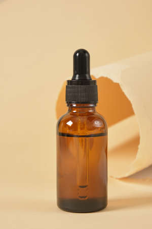 Dropper Bottle with clipping path on a beige backgroundの写真素材