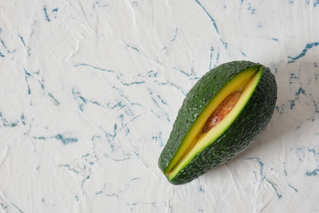 fresh sliced avodcado fruit on light background
