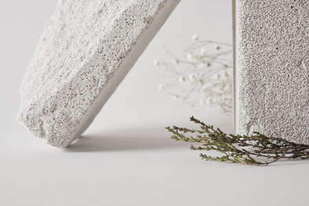 concrete podiums and dry grass, mock-up background for your product presentation concept, copy space template, minimalist product show backgroundの写真素材