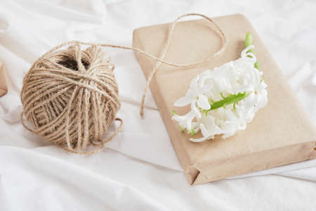 white Hyacinth flowers and gift box on bedの写真素材