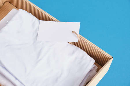 women's underwear in a box with a blank label without marking on a blue background mock upの写真素材