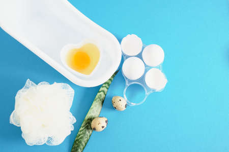 chicken egg shells, quail eggs, a heart-shaped bowl with a raw egg for making a face and hair mask,...