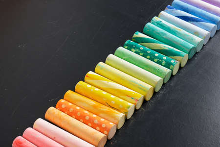 crayons for the board are laid out in a row, original large chalk with a pattern Dark chalk board...