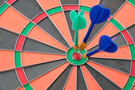 dart hit the target, win by points, business concept yellow background