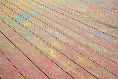 the Indian festival holi, Hindi, the remains of color powder on wooden stageの写真素材