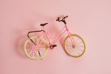 toy bicycle on a pink background copy space top viewの写真素材