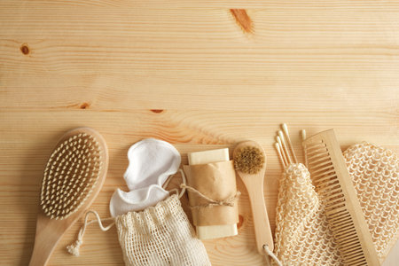 eco self care kit, bamboo and tin items, cotton sponges and homemade soap on wooden background, zero waste lifestyleの写真素材