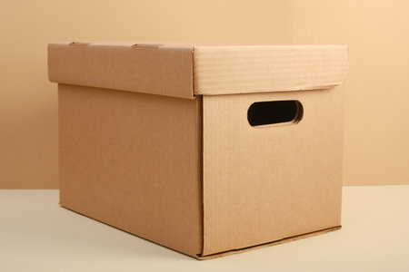 craft office box with hand slots on beige background mock upの写真素材