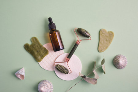 self-care set made of natural materials and components, natural cosmetics and reusable concept, facial massage with guasha and rollerの写真素材