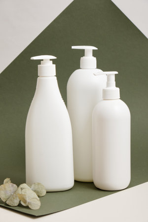 three white bottles without label, mock up natural cosmetics productの写真素材