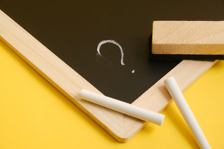 black chalk board with question mark written in chalkの写真素材