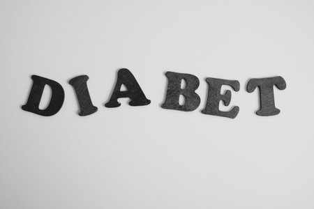 inscription diabetes from wooden letters, black and white photoの写真素材