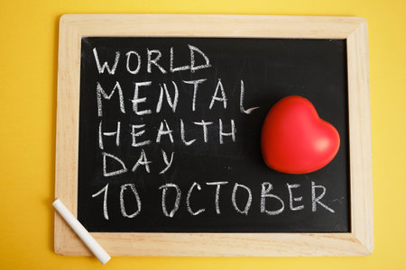 chalk board inscription world mental health day on yellow background, emotional health concept, October 10の写真素材