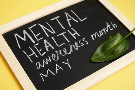 chalk writing on black board mental health awareness month may, psychological health conceptの写真素材
