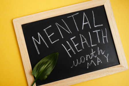 chalk inscription on blackboard mental health month may, mental health concept