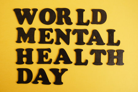 inscription world mental health day on yellow background, psychological health concept, October 10の写真素材