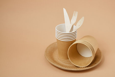 Eco paper plate fork on beige background no plastic, recyclable tablewareの写真素材