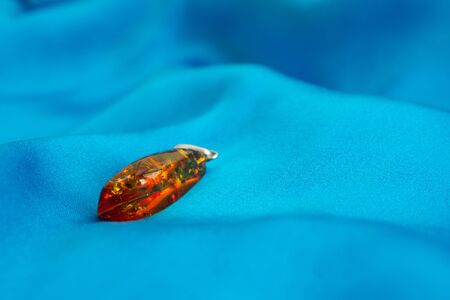 amber yellow on blue silkの写真素材