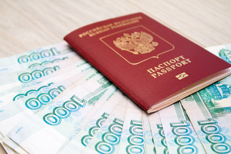 business, finance, saving, banking, travel and people concept - close up bundle of money Russian...