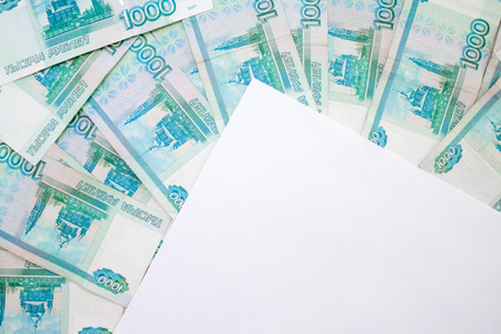 business, finance, saving, banking concept - close up bundle of money Russian Banknotes thousand rubles on wooden tableの写真素材