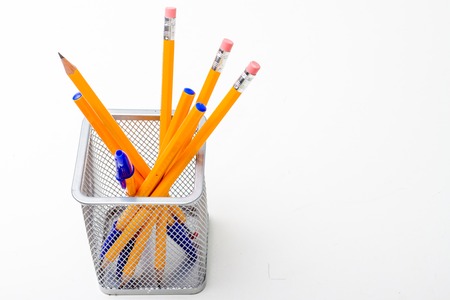 Back to school and education concept - school office supplies pencils, pens in stand on white background. Copy spaceの写真素材
