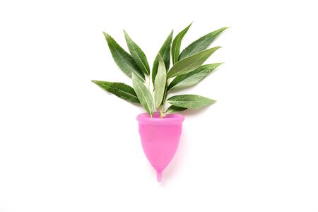 Reusable menstrual cup and tampon on pink background, Concept female intimate hygiene period products and zero waste. Flat lay, minimalism, top view. copyspace.の写真素材