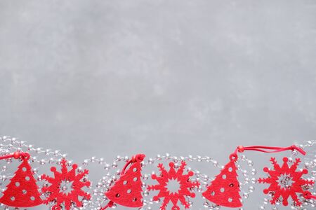 Christmas composition frame for text. Red decorations on grey background. Flat lay, top view - greeting card template christmas and New Year. copyspaceの写真素材