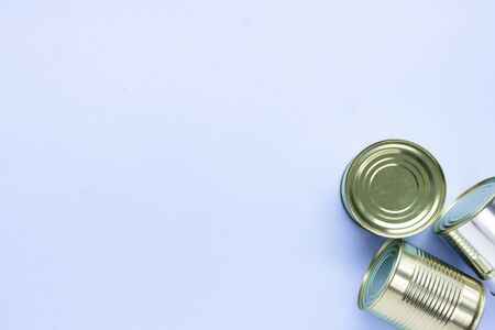 Food supplies crisis food stock for quarantine isolation period on blue background. canned food....