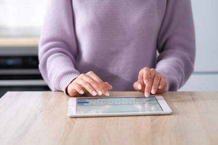 Hands on digital tablet keyboard close up girl working office work remotely typing text, woman using...