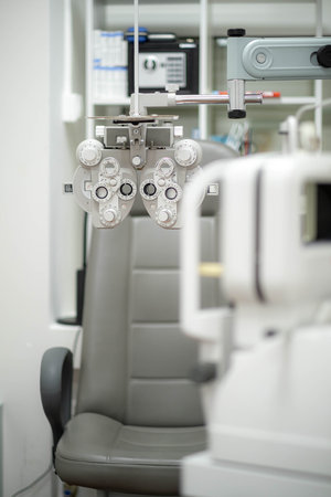 Ophthalmological cabinet with modern equipment in a medical clinic featuring an examination chair...