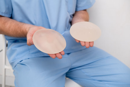 doctor holding breast enlargement implant in hands, plastic surgery concept, beauty enhancement, medical Mammoplasty and plastic surgery, mastopexyの写真素材