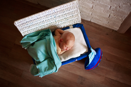 sleeper newborn baby in white boxの写真素材