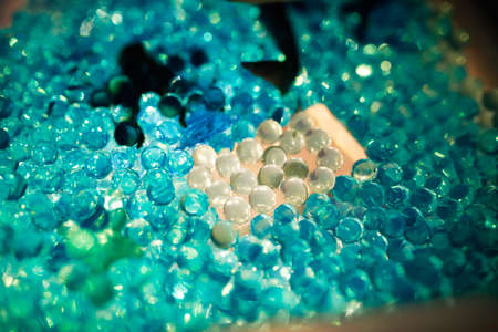 Close-up of a blue glass beads on a tableの写真素材