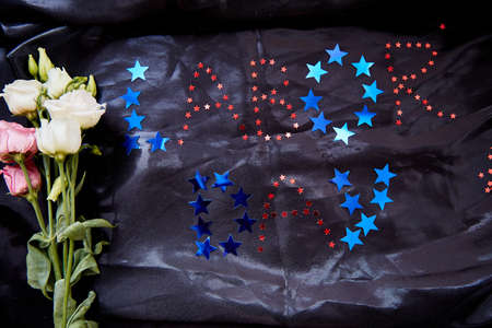 Labor day international workers day concept. Festive text in American style with eustoma flowers....