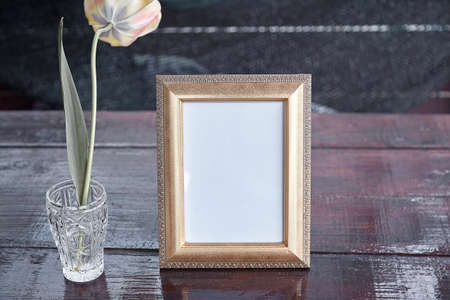 Elegant spring mock up frame with tulip flower. Stylish mock up. Modern interior, minimalistic concept. Copy space. Trendy treatment.の写真素材