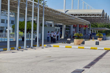 Antalya, Turkey: May 26, 2021: Masked people working at the airport. Traveling during a pandemic....