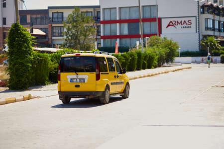 Alanya, Turkey - May 26: Yellow taxi on the road on bright sunny day. Travel Turkey concept. High quality photoのeditorial素材