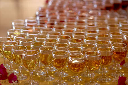 A lot of glasses of wine with flowers. Assortment of different wines. High quality photoの写真素材