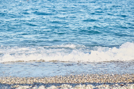 Clear blue water surface in sunny day, seamless pattern, texture. Natural background with bokeh...