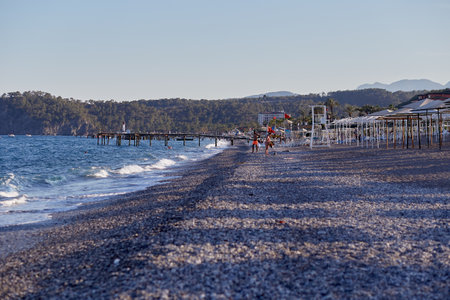 Kemer, Turkey - May 22, 2021: The sea at sunset. Natural background with bokeh lights. Summer vacations background.のeditorial素材